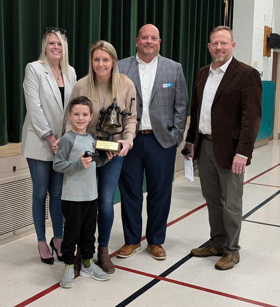 1st grader Huck Bushard and Mrs. Offerman from Marrs Elementary, with (l-r) Ashley Blocker, Jason May and Jody Peacock with Ports of Indiana. Huck was one of three students to submit "Wildcat Express."