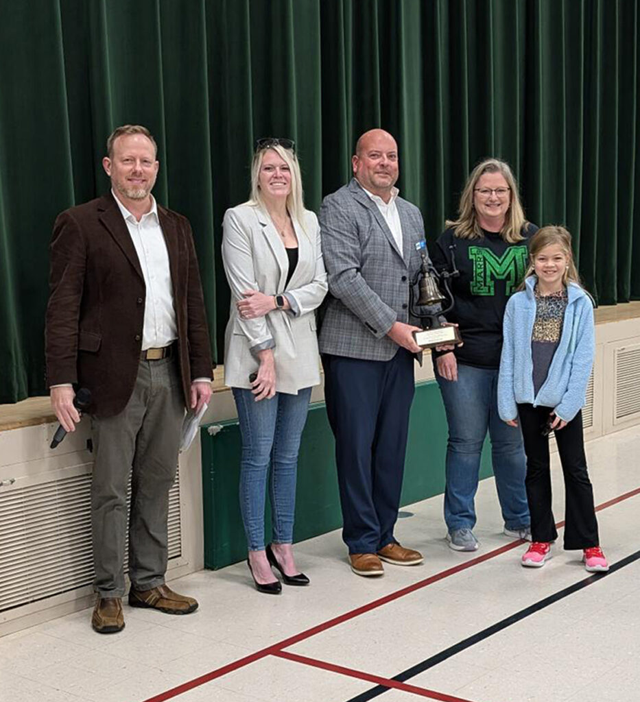 3rd grader Lillian Falls and Mrs. Weatherford from Marrs Elementary, with (l-r) Jody Peacock, Ashley Blocker and Jason May with Ports of Indiana. Lillian submitted the winning entry for "Power Paws."