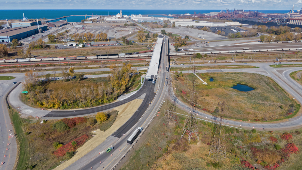 Looking north, crews put the final touches on the new State Road 249 bridge. on the left. Below the bridge (front to back) is U.S. Hwy.12, the South Shore Line, and Norfolk Southern railroad.